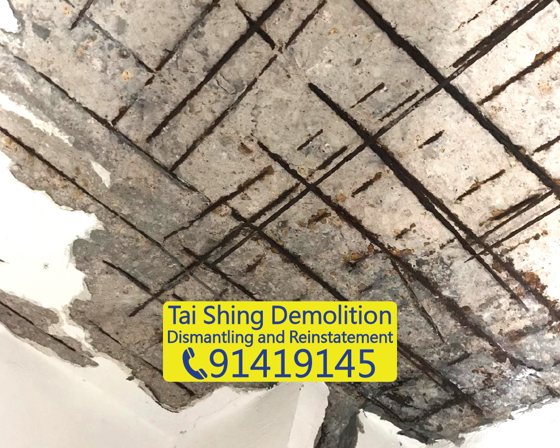 Concrete spalling and exposed rebars after UBW demolition, preparing for structural repair, Tai Shing Demolition