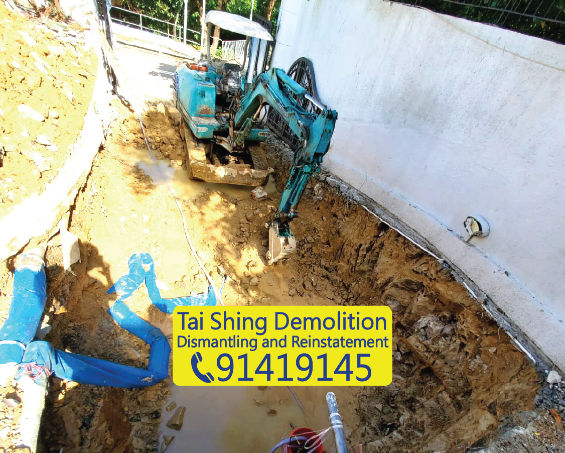 Mini excavator digging a garden pond in a Hong Kong villa, precise depth control for landscape design preparation by Tai Shing Demolition